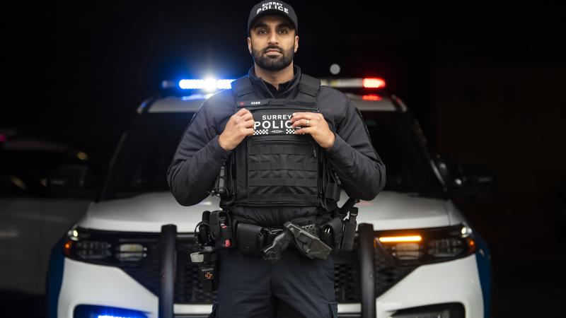 officer in front of a car