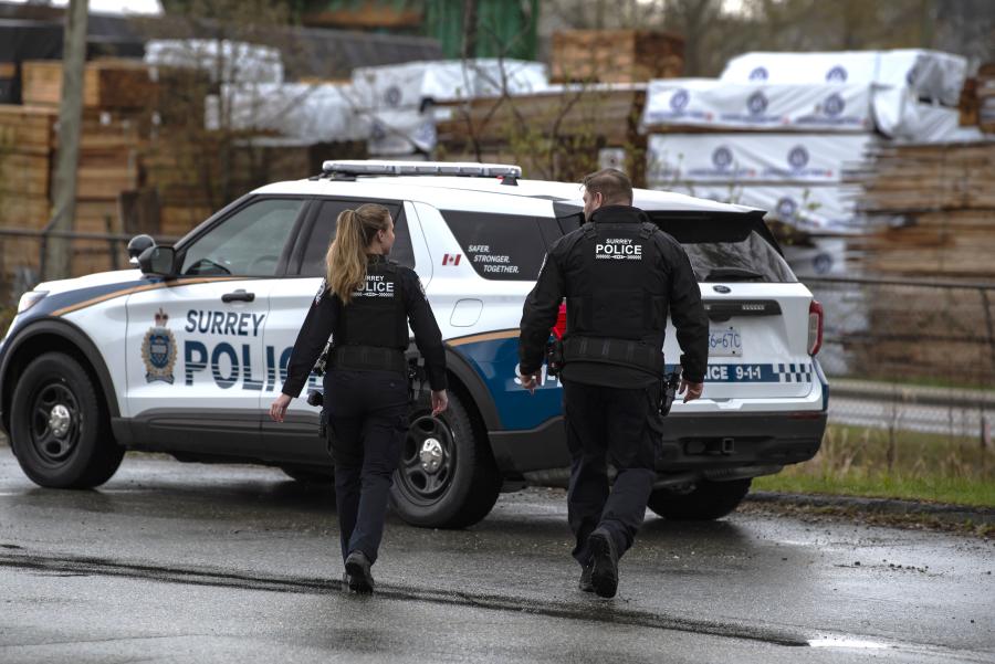Officers walking to police vehicle