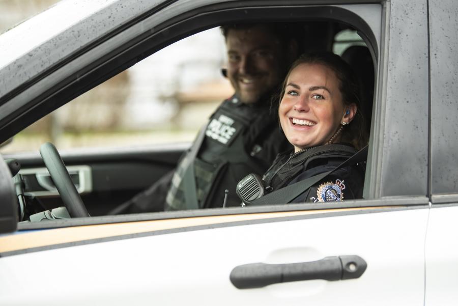 Two officers in a SPS police vehicle